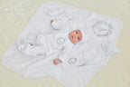 Personalized linen christening set for baby – embroidered baptism outfit with blanket, shirt, pants, hat, and booties.