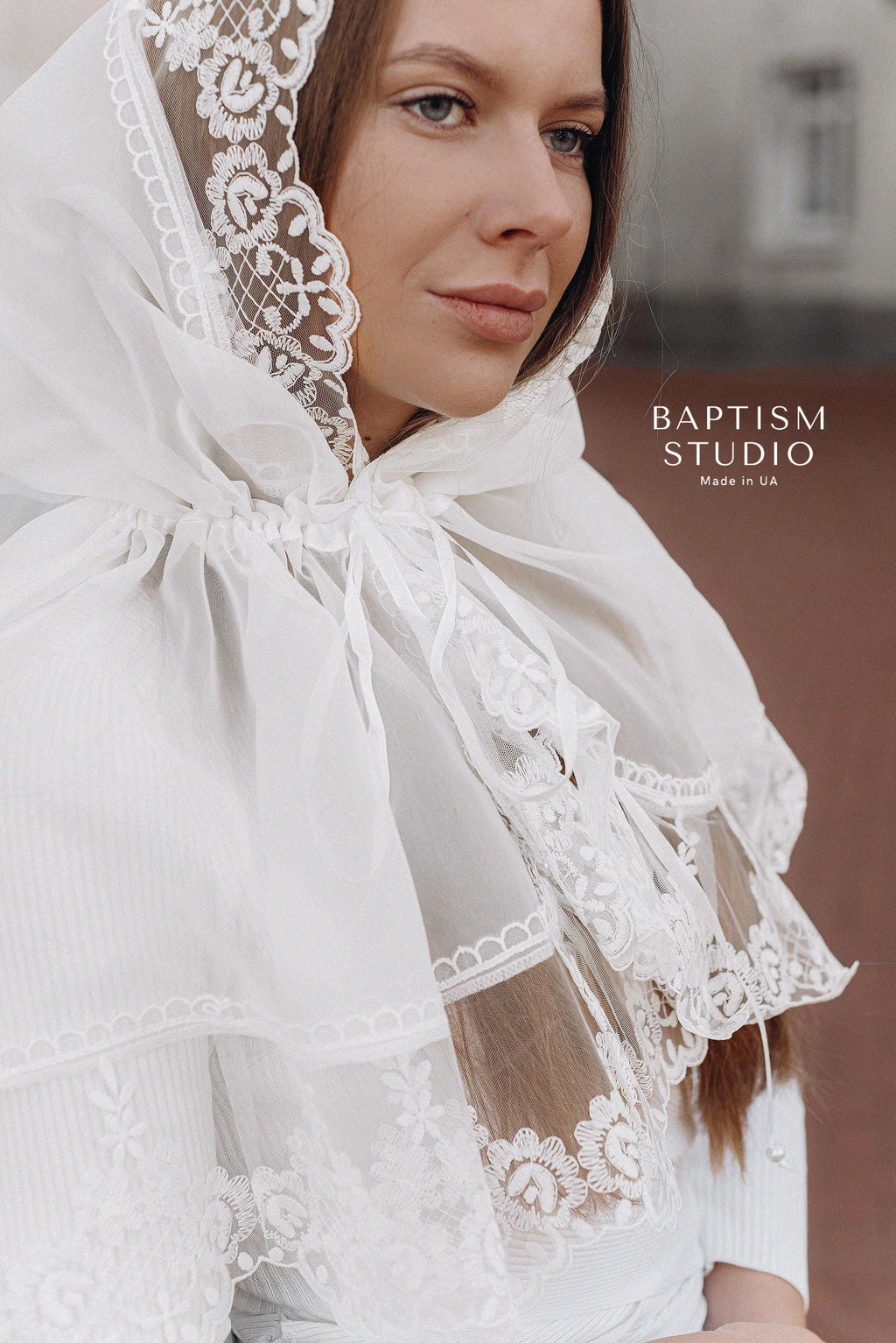 Christian woman wearing elegant white lace prayer shawl inside church, modest religious head covering