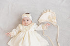 Neutral baptism gown set for baby girl with lace details