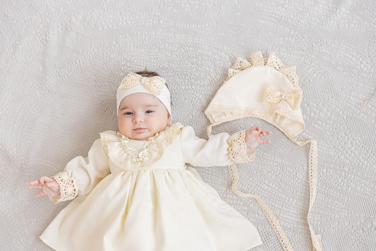 Neutral baptism gown set for baby girl with lace details