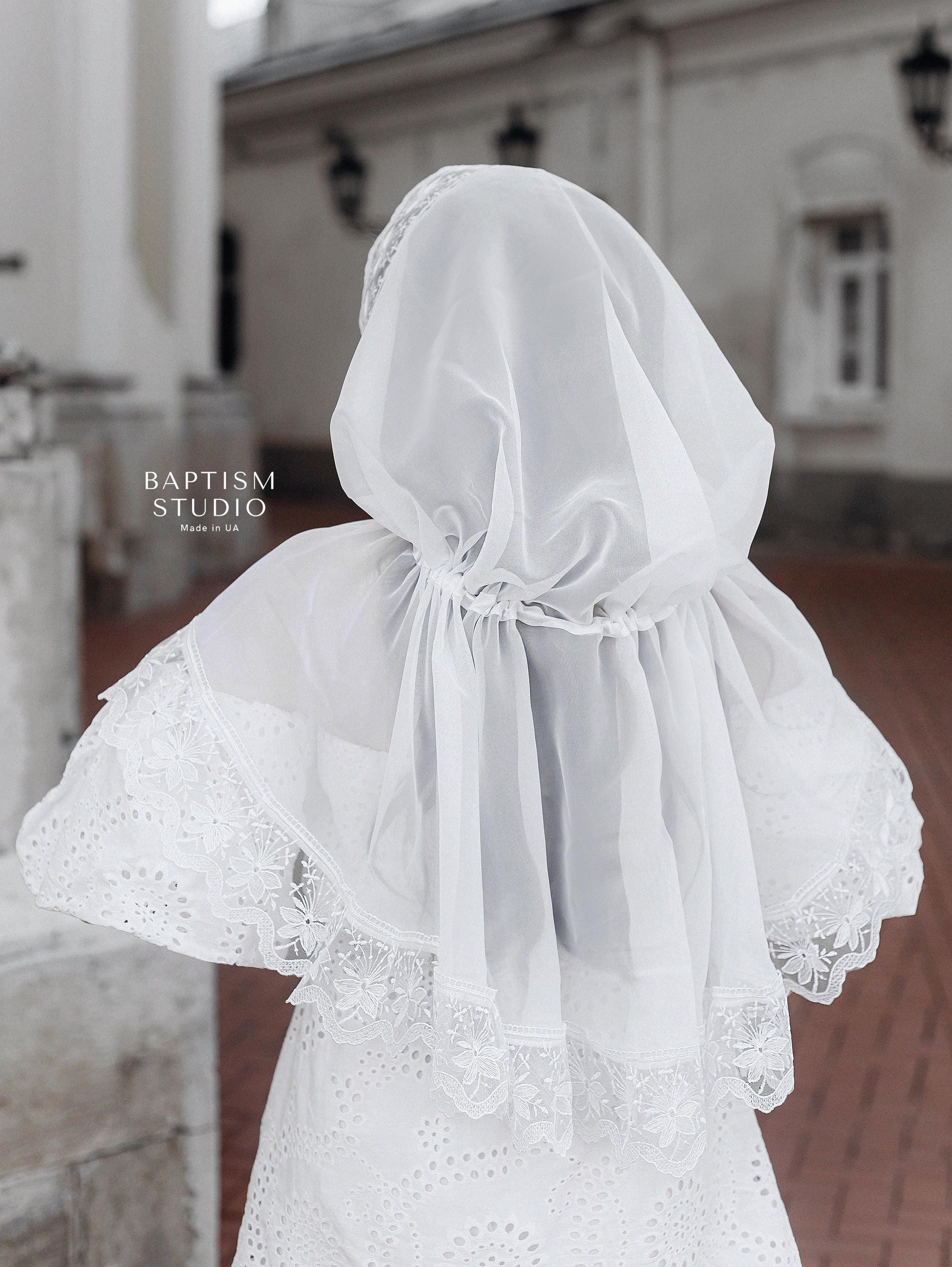 Christian woman wearing elegant white lace prayer veil outdoors, modest church head covering