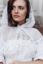 Close-up of delicate floral lace trim on white church veil, handmade religious head covering