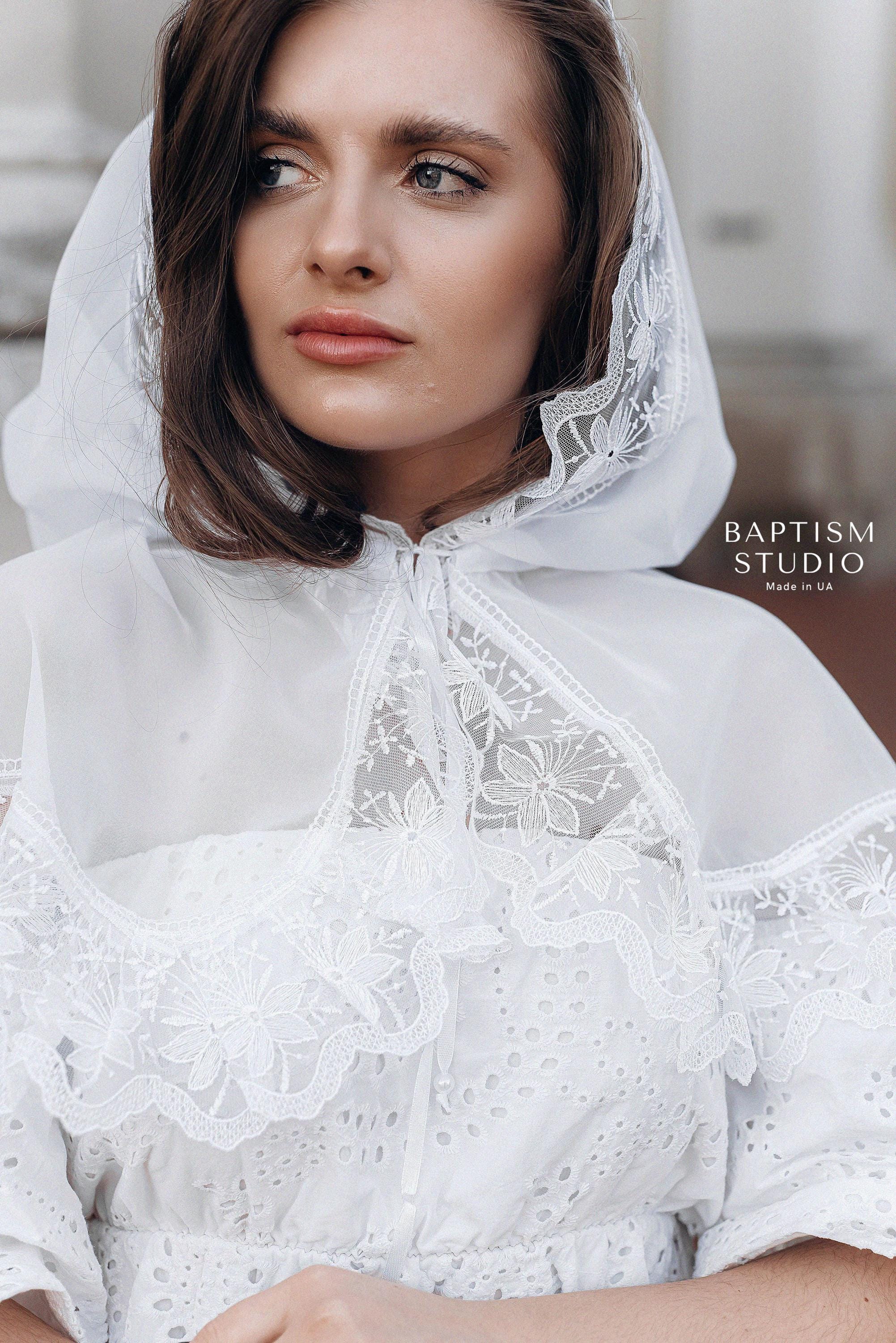 Close-up of delicate floral lace trim on white church veil, handmade religious head covering