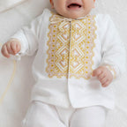Elegant linen christening outfit with embroidered shirt and baby accessories