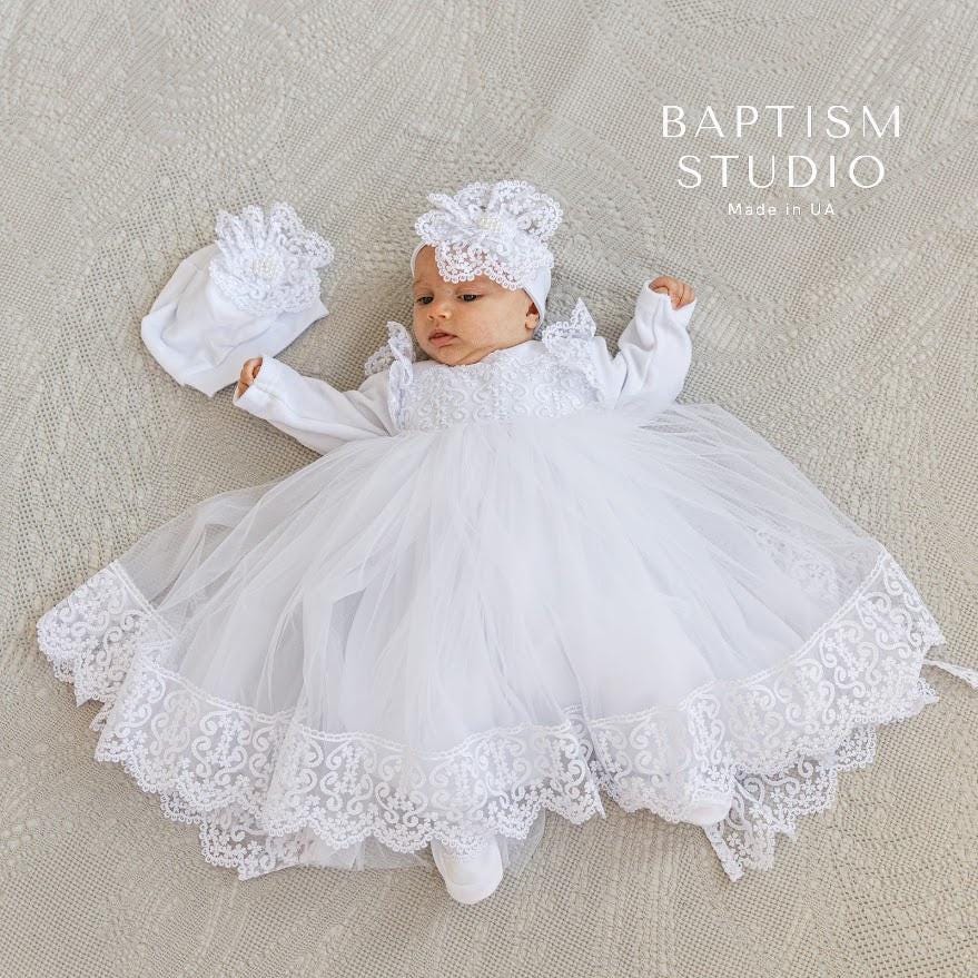 Baby girl in velvet christening dress with lace trim

