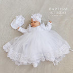 Baby girl in velvet christening dress with lace trim

