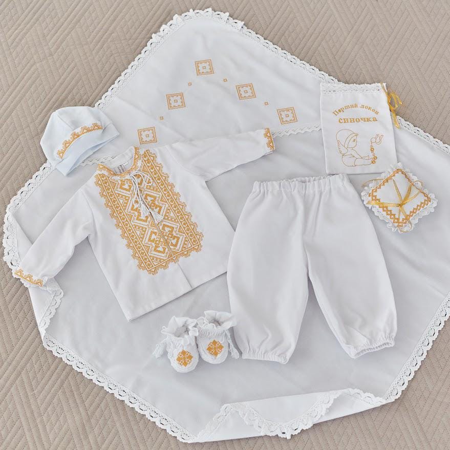 Linen baby christening set with gold embroidery – outfit, blanket, booties, hat, pouch, and cross cushion