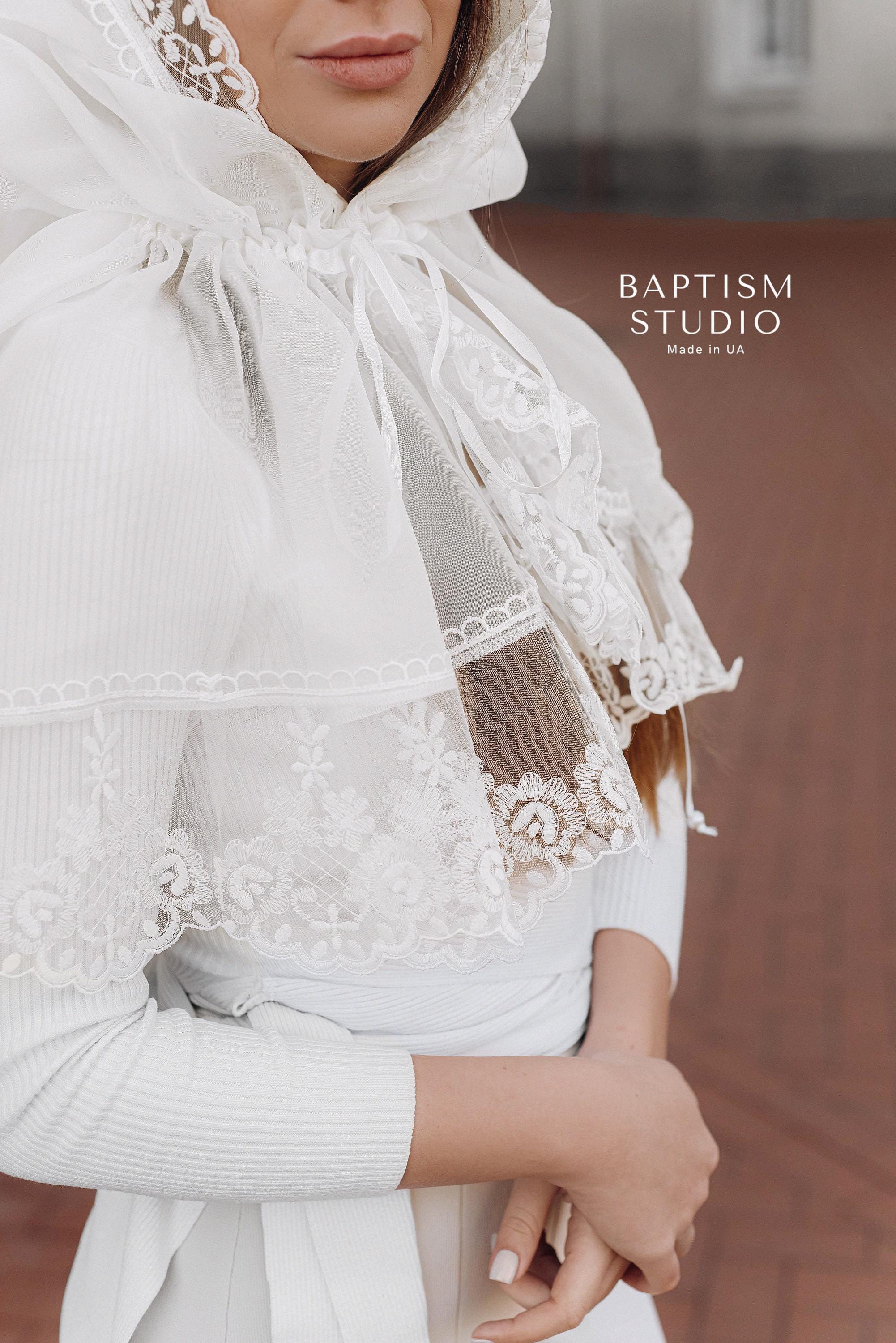 Close-up of floral lace trim on white church palantine, handmade religious prayer shawl