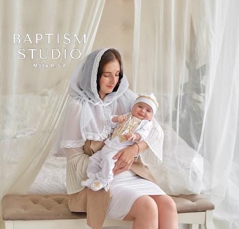 White christening outfit for baby boy with embroidered details