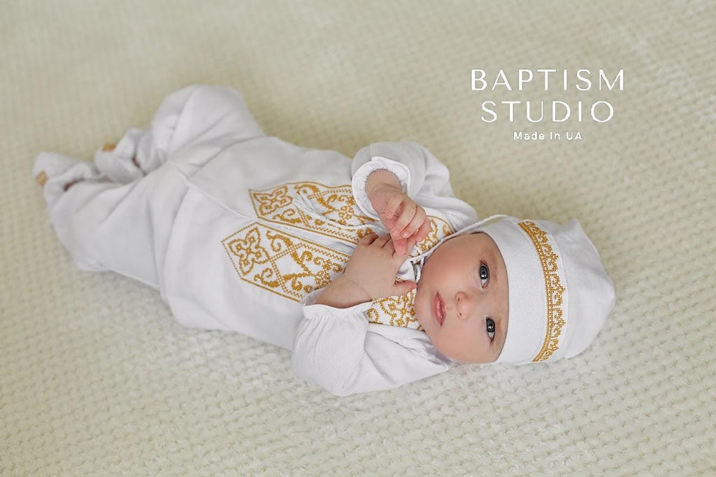 White baby baptism outfit with matching booties and hat