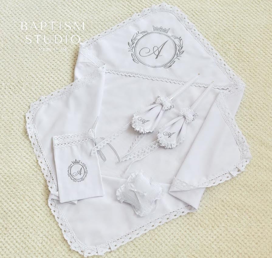 Linen christening blanket with lace edge and embroidered baby initial – personalized baptism gift.