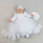 White baby girl baptism dress made of velour with embroidered lace