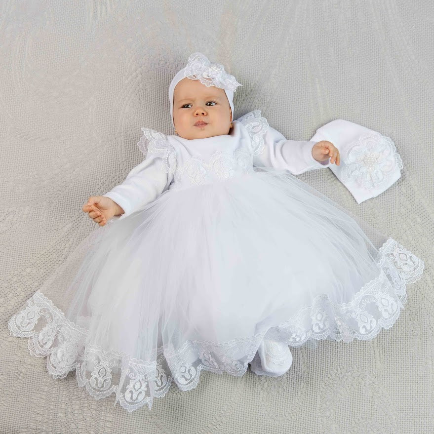 White baby girl baptism dress made of velour with embroidered lace